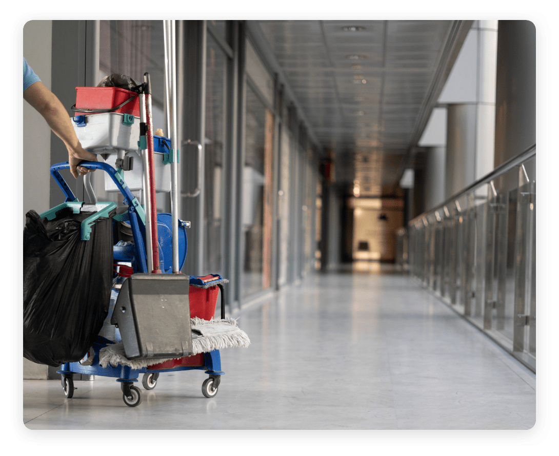 Cleaning equipment in an office corridor, showcasing how occupancy intelligence can streamline workplace maintenance and resource allocation.